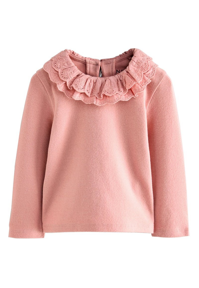 Roze top met lange mouwen, voorzien van een gestructureerde kanten ruchesluiting bij de hals, een rits aan de achterkant en een zachte fleece stof. Eenvoudig ontwerp en comfortabele pasvorm.