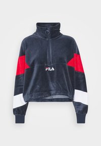 Marineblauwe fleece trui met een hoge kraag, ritssluiting, rood-wit gestreepte accenten en geborduurd logo aan de voorkant.