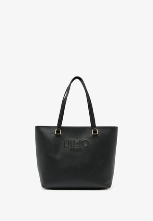 Czarna syntetyczna torba typu tote ze złotym okuciem, wytłoczonym logo marki, o zwartej konstrukcji i podwójnych uchwytach na ramię. Gładka faktura.