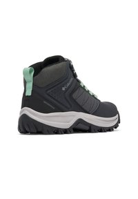 Wasserdichte Columbia Mid-Cut Wanderschuhe in Grau und Schwarz, mit strukturiertem Mesh, grünen Akzenten und einer robusten Sohle für Halt.