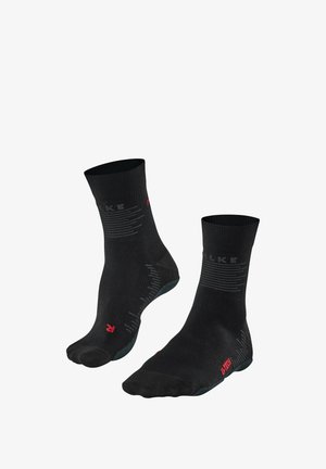 Czarne skarpetki sięgające kostki wykonane z oddychającego materiału. Posiadają szare poziome paski oraz czerwone logo po boku. Teksturowana podeszwa zapewniająca przyczepność.