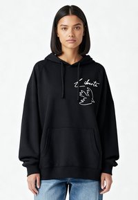 Sweat à capuche noir avec cordon de serrage, poche kangourou devant, motif d'oiseau blanc et texte "liberté" sur la poitrine. Tissu confortable, coupe décontractée.