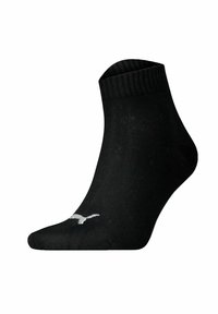 Black ankle sock with ribbed cuff and small white logo near the toe, shown against a white background.