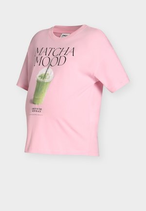 Light pink short-sleeve t-shirt with "MATCHA MOOD" text and an illustration of a green matcha drink in a clear plastic cup with a straw.