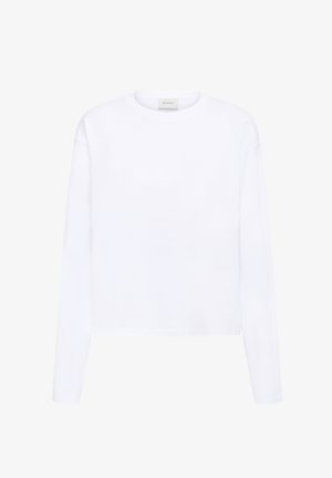 Valge pika varrukaga ümmarguse kaelusega särk sirge äärega ja väikese sildiga kaeluse siseküljel.