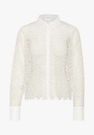 Valkoinen, kukkakuosisella pitsillä varustettu paita, jossa on pitkät hihat, kauluspääntie ja nappikiinnitys. Sisältää aaltoilevan helmavarteen ja erottuvan valkoisen hihan suut.