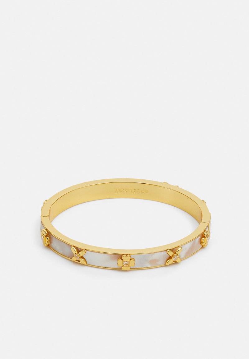 Gold-tone bangle bracelet with inlaid iridescent material and decorative flower accents. Features smooth surfaces and clear gemstone details.