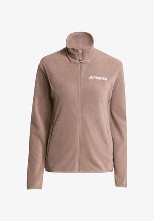 Fleece-Jacke in Hellbraun mit hohem Kragen, durchgehendem Reißverschluss und weißem TERREX-Logo. Verfügt über Seitentaschen und eine weiche Textur.