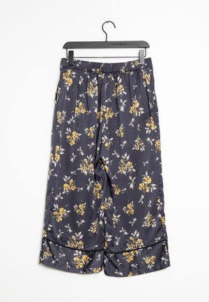 Blumenmuster-Weitbeine-Hosen aus dunkelblauem Stoff, mit gelben und weißen Blumenmustern, elastischem Bund und gekürztem Saum mit Paspelierung.