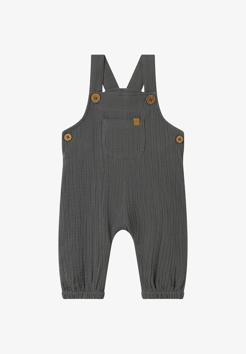 Sivi bombažni kombinezon z nastavljivimi trakovi, lesenimi gumbi, sprednjim žepom in elastičnimi manšetami. Teksturna tkanina z gubanim videzom.