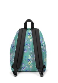 Zaino con motivo floreale su sfondo verde menta, dotato di spallacci imbottiti neri e maniglia superiore per il trasporto.
