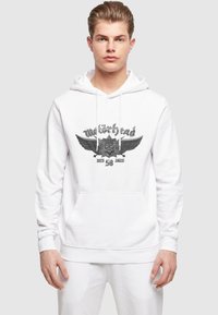 Witte hoodie met een buidelzak, voorzien van een zwarte grafische print van een schedel met vleugels en de tekst "Motörhead". Katoenen materiaal.