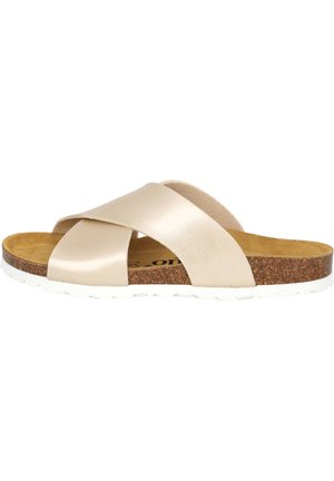 Beige leather slide sandal with crossed straps, cork footbed, and white rubber sole featuring textured grip. No visible patterns or accents.