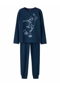 Marineblaues Schlafanzugset, bestehend aus einem langärmeligen Oberteil mit einem weißen Skateboard-Graphic und passenden einfarbigen Hosen mit umgekrempelten Knöcheln.