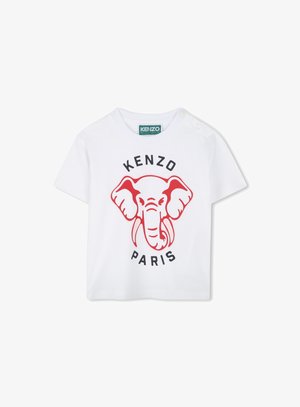 T-shirt blanc à manches courtes en coton avec un graphique d'éléphant rouge et le texte "KENZO PARIS" en dessous, avec des boutons pression sur l'épaule.