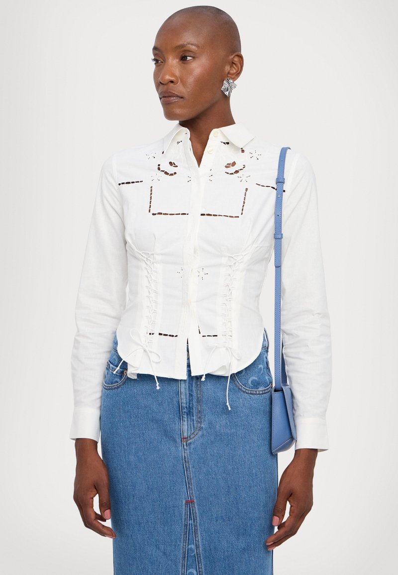 ASOS DESIGN - Mini-jupe boutonnée en jean - Bleu délavé moyen | ASOS