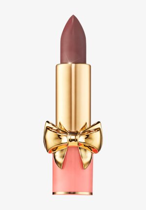 Lipstick with a pointed tip in a muted mauve shade. The tube features a glossy gold finish with a decorative gold bow and a pink base.
