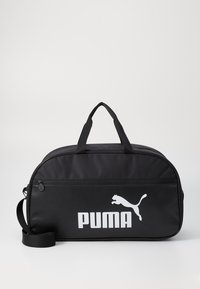 Borsa a tracolla nera realizzata in tessuto resistente. Presenta un logo PUMA bianco, una tasca frontale con zip, manici doppi e una tracolla regolabile.