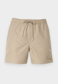 Shorts de bain beiges avec une taille élastique et un cordon de serrage. Dotés de poches latérales et d'un petit logo en accent sur l'ourlet. Texture lisse.