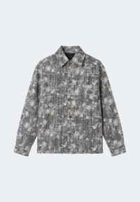 Giacca grigia a maniche lunghe con un motivo floreale sottile, chiusura frontale con bottoni, colletto e taschino sul lato sinistro del petto.