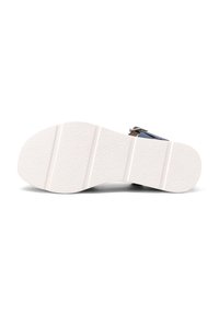 Sola della sandalo con suola in gomma bianca texture. Presenta tre scanalature orizzontali per una migliore presa e una leggera curvatura nella punta.