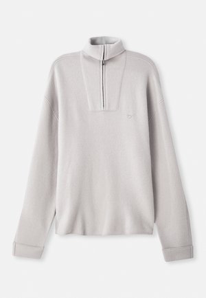 Light grey fleece pullover with a half-zip collar, long sleeves, and a small logo on the chest. Soft texture and relaxed fit design.
