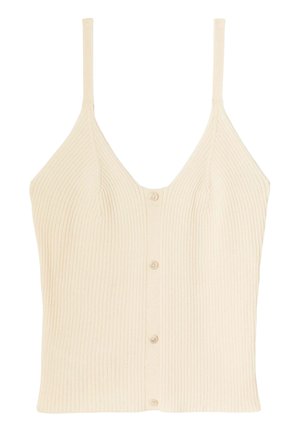 Top en crème à côtes avec des bretelles fines réglables et un design en V, présentant une fermeture à boutons sur le devant et une texture en tricot doux.