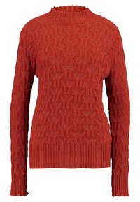 Orange stickad tröja med en texturerad, mönstrad design. Har hög krage och långa ärmar med ribbade mudd och nederkant.