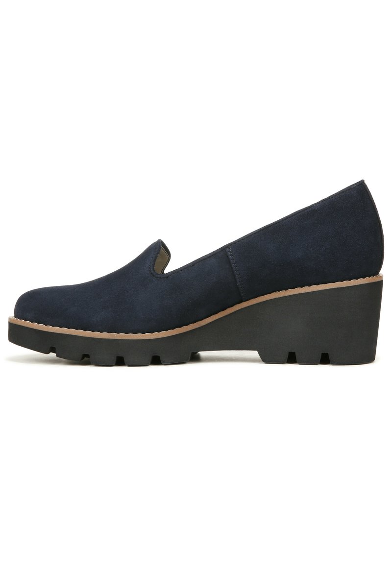 Navy blue suede wedge shoes with a rounded toe, slip-on design, and a textured black rubber sole featuring deep tread for grip.