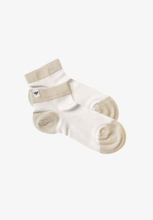 Coppia di calzini bianchi alla caviglia con polsini, talloni e punte beige, caratterizzati da un piccolo logo nero sul polsino laterale.