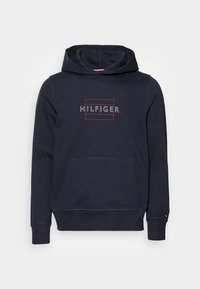 Felpa con cappuccio blu navy realizzata in misto cotone, dotata di tasca frontale, polsini a costine e logo "HILFIGER" in colori a contrasto.