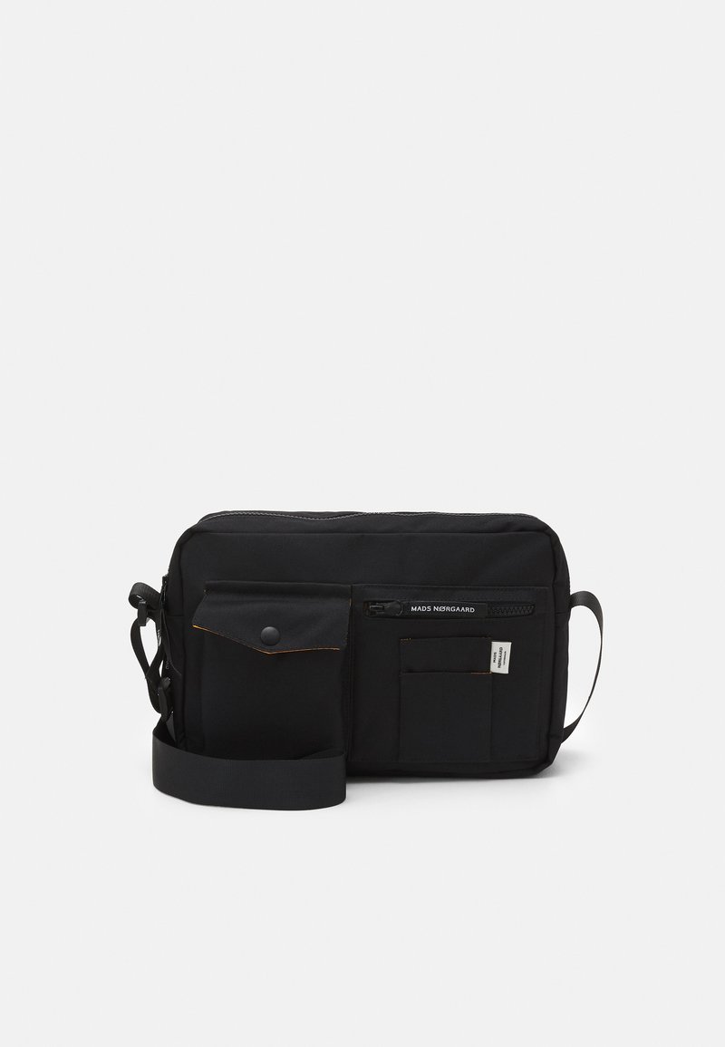 Black messenger bag made of durable fabric, featuring a zip closure, front flap pocket, and adjustable strap for comfortable wear.