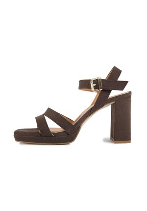 Brown suede high-heeled sandal with chunky heel, two front straps, ankle strap with silver buckle, and platform sole.