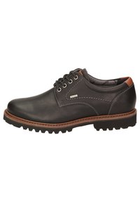 Scarpa in pelle nera con dettagli marroni, punta rotonda, design con sei occhielli per i lacci e suola in gomma robusta. Presenta cuciture a contrasto.