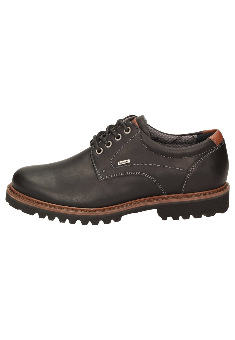 Scarpa in pelle nera con dettagli marroni, punta rotonda, design con sei occhielli per i lacci e suola in gomma robusta. Presenta cuciture a contrasto.