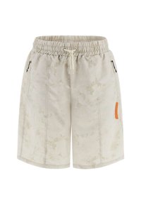 Light beige shorts with a subtle mottled pattern, elastic waistband, drawstring, and black zippered pockets. Features an orange logo patch.