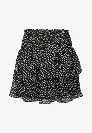 Zwarte gelaagde rok met witte onregelmatige polkadots en een brede, gerimpelde elastische tailleband van vloeiende stof.