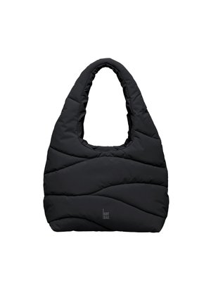 Sac fourre-tout matelassé noir avec poignée rembourrée et surpiqûres en forme de vagues discrètes, arborant un petit logo "GOT BAG" près du centre inférieur.