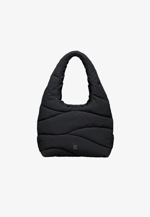 Schwarze gesteppte Tragetasche mit gepolstertem Griff und dezenten Wellensteppungen, mit einem kleinen "GOT BAG"-Logo nahe der unteren Mitte.