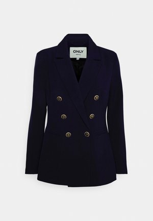 Blazer bleu marine à double boutonnage en tissu lisse. Caractérisé par des boutons dorés, un col cranté et deux poches avant.