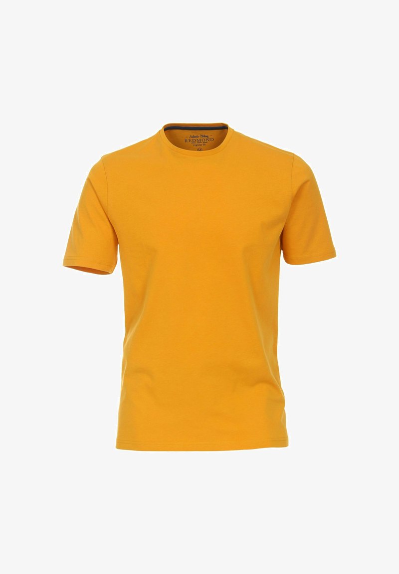Gul bomulds T-shirt med korte ærmer og rund halsudskæring. Glat tekstur, almindelig pasform, mærket med "Redmond" indeni.