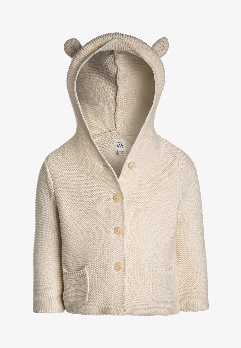 Cardigan bébé en maille crème avec capuche ornée de petites oreilles d'ours, poches frontales et quatre boutons au centre.
