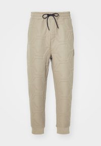 HADIKO HEXAQUILT - Pantalon de survêtement - light/pastel green