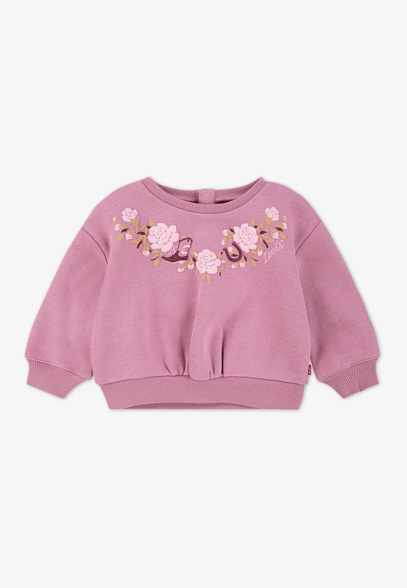 Sudadera rosa claro con bordado floral en tonos suaves de rosa y verde, con un corte holgado y puños y dobladillo de canalé.