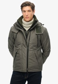 Unselected, surplus goods olive