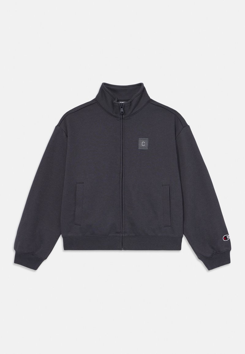 Dark gray zip-up jacket made of soft fabric. Features a high collar, two side pockets, and logo patch on the left chest, with ribbed cuffs.