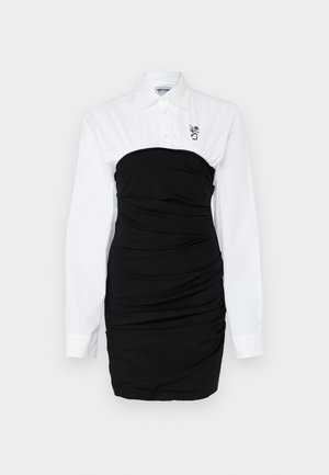 Fekete testhezálló ruha, ráncolt dizájnnal, fehér, gombos inggallérral és hosszú ujjakkal. Finom logó részlet a mellkason.