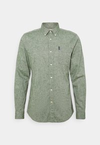Zelená košile s dlouhým rukávem na knoflíky z texturované látky, s špičatým límečkem, přední kapsou a malým logem na levé hrudi.