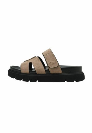 Sandalias de ante color canela con dos correas ajustables, suela de goma negra y una banda de rodadura texturizada para mayor agarre. Diseño minimalista con líneas limpias.
