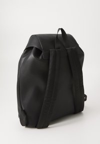 Black backpack with a smooth, matte finish, featuring two sturdy fabric straps and a rounded, compact design.